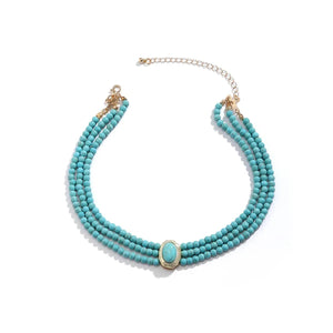 Flerradigt choker-halsband med turkosa pärlor
