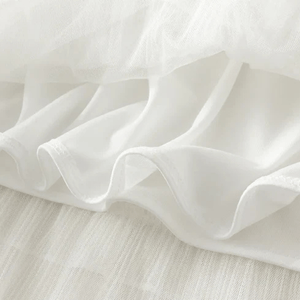 Lång tyllkjol med plisserade volanger