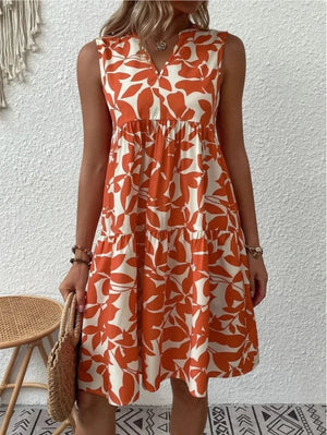 Blommig klänning knälång