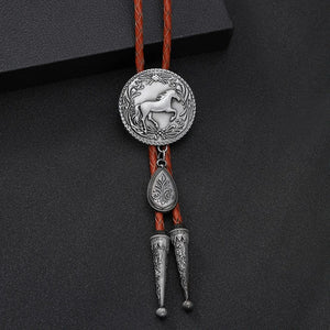 Bolo tie med rund hästberlock och läderband